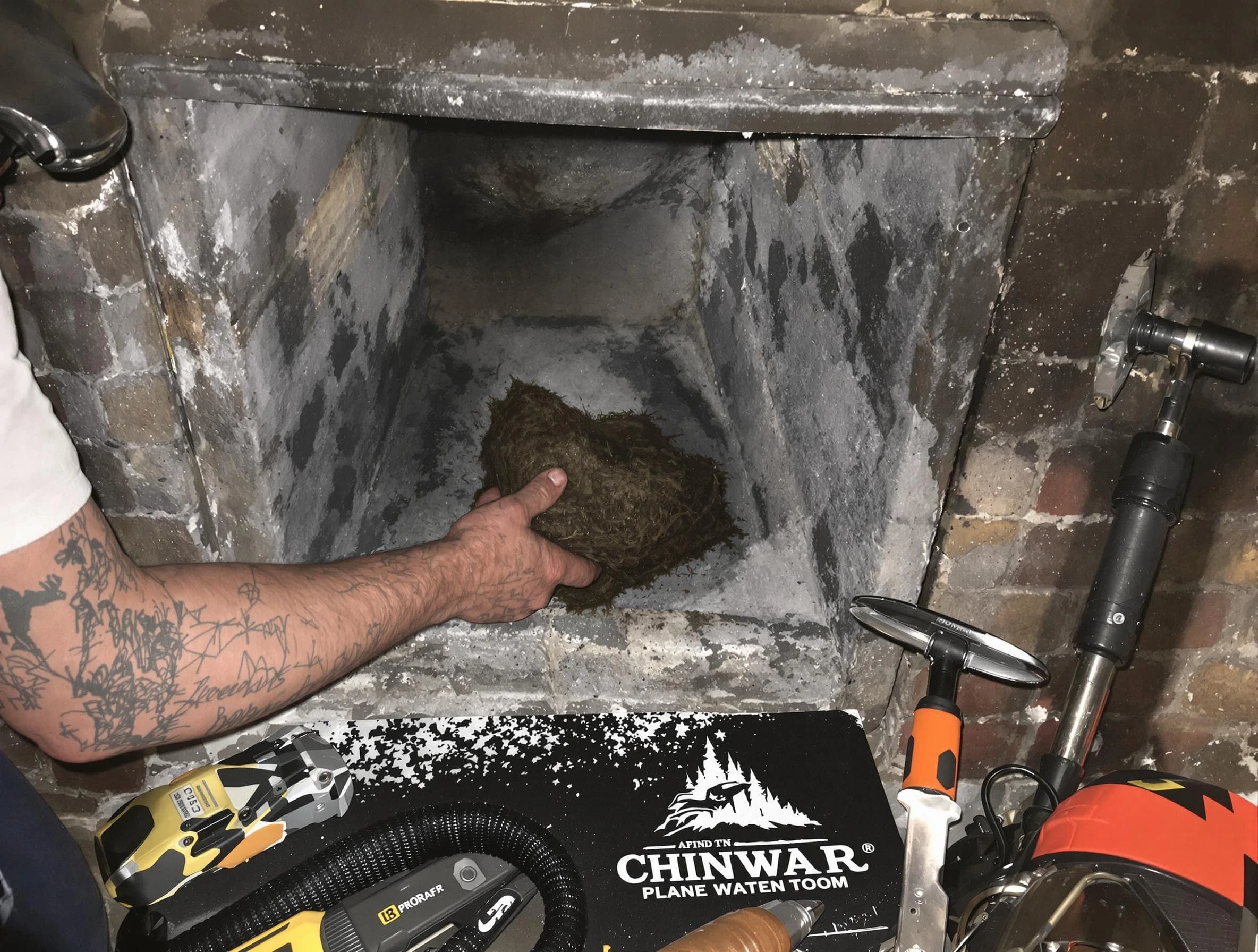 Randolph Chimney Sweep safely removing debris and screening chimney in Randolph, MA